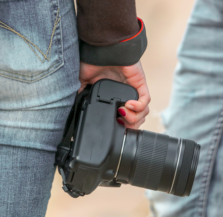 The camera in the girl's hand .の写真素材