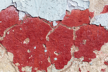 Concrete wall with cracked paint as abstract background.の写真素材