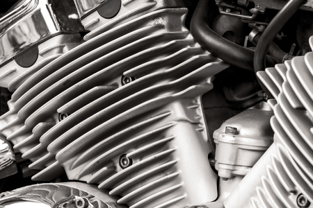 Metal parts on a motorcycle as a background.