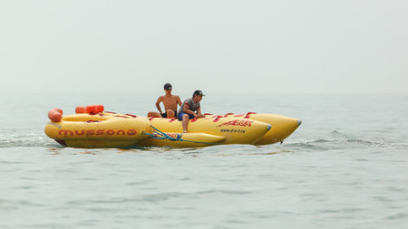 Sochi, Russia - June 4, 2019: People ride on a banana in the Black Sea .