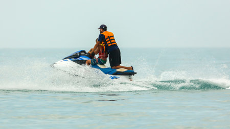 Sochi, Russia - June 4, 2019: People ride on a water bike in the Black Sea .のeditorial素材