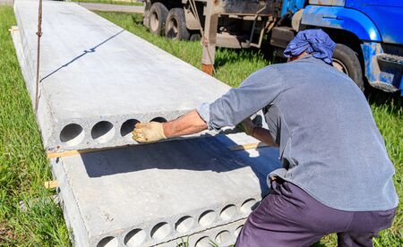 Installing concrete slabs at a construction site at home .の写真素材