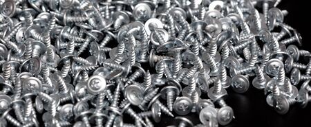 Sharp screws on a black background.
