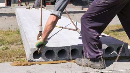 Installing concrete slabs at a construction site at home .の写真素材