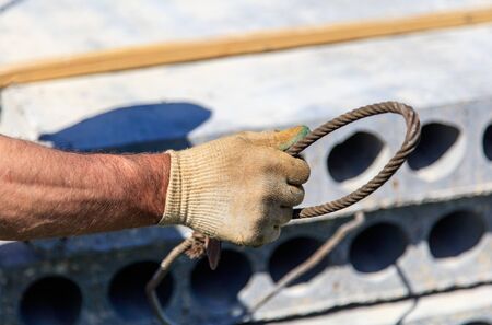 Installing concrete slabs at a construction site at home .