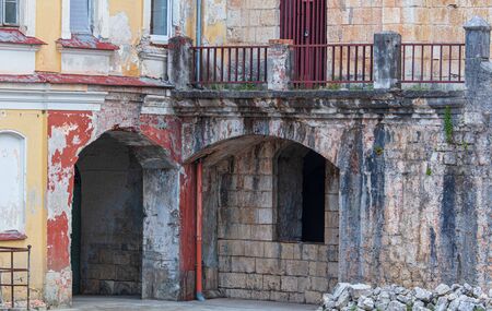 Windows and walls in an ancient old house .