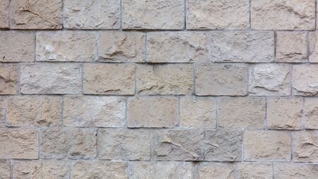 Decorative bricks on the wall of the house as a background.