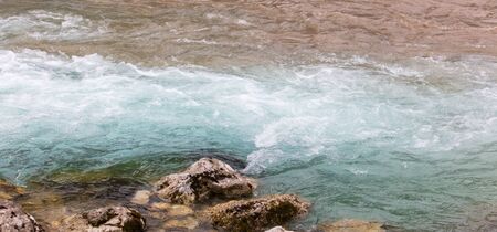 Dirty and clear water mixed in the river .の写真素材