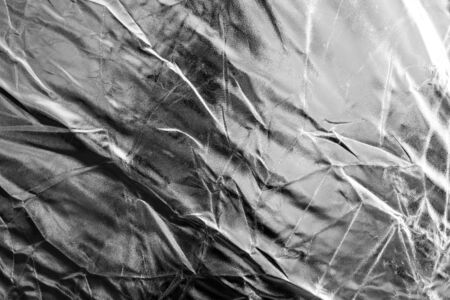 Crumpled silver material as abstract background .の写真素材