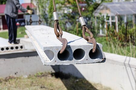 Installing concrete slabs at a construction site at home .の写真素材
