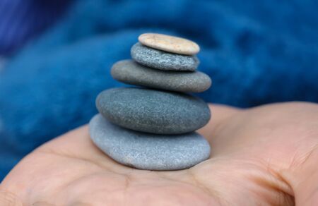 Pebbles in the hands of a girl .の写真素材