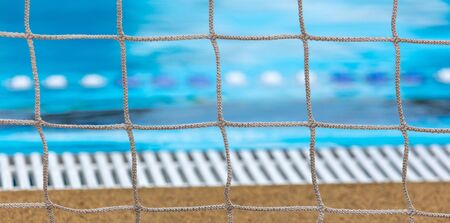Grid over the pool water. Water polo