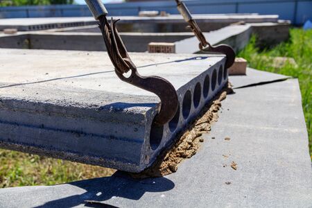 Installing concrete slabs at a construction site at home .の写真素材