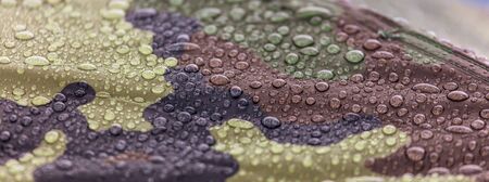 Raindrops on khaki color tent as abstract background .の写真素材