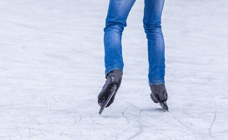 Skates on the feet of a boy in winter.の写真素材