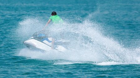A man rides a water bike in the water. Summer vacation at sea