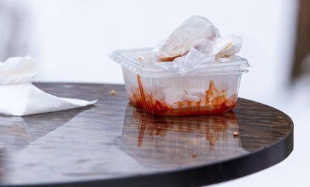 Eaten food in a container on the table.の写真素材