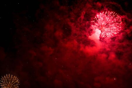 Colorful fireworks in the sky at night as background.