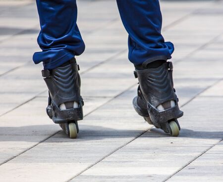 Rollers on the legs of a man in the park.の写真素材