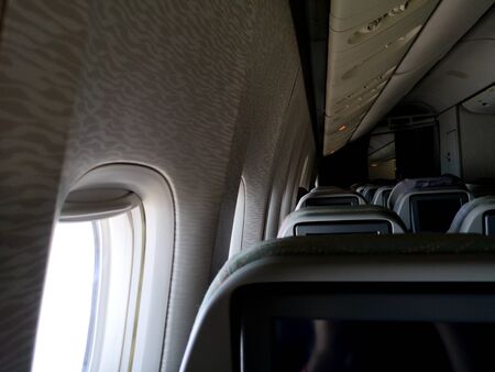 Porthole on the plane. Flying in the sky