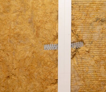 Cotton wool insulation in the wall at a construction site.