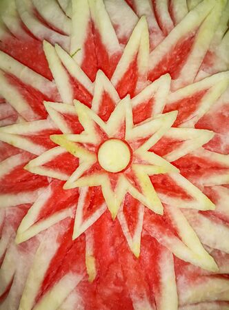 Drawings carved on a watermelon as a background.の写真素材
