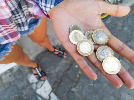 Coins of Turkey in the hands of a girl.の写真素材