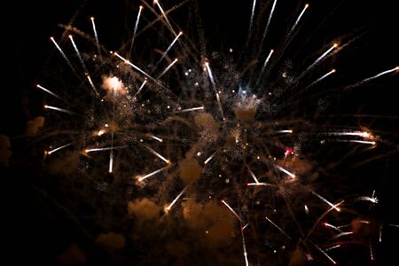 Colorful fireworks in the sky at night as background.