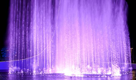 Dancing fountain in the park. Splashing waterの写真素材