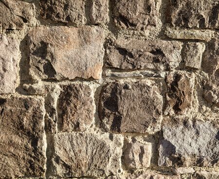 Wall of stone blocks as an abstract background.