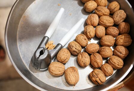 Fresh walnuts in the market. Nut crackerの写真素材