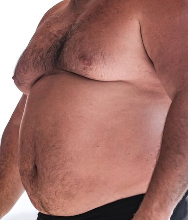 Big belly of a fat man on the beach.の写真素材