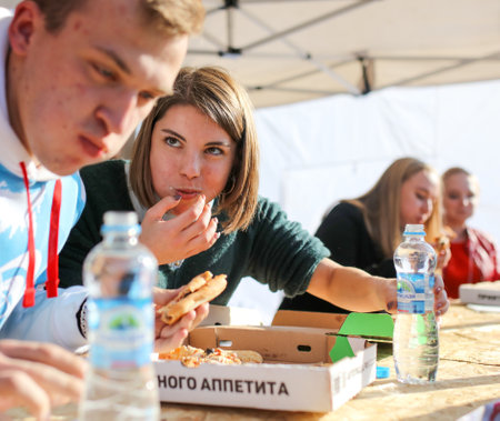 Lipetsk, Russia - September 21, 2019: Gastronomic festival. Pizza eating contest in the park.のeditorial素材