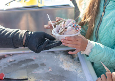 Lipetsk, Russia - September 21, 2019: Gastronomic festival. Seller of fried ice cream in the park.のeditorial素材