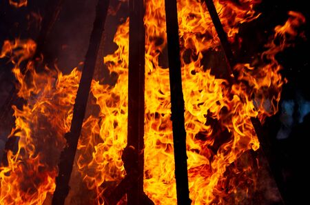 Flame of fire from a burning house as an abstract background.の写真素材