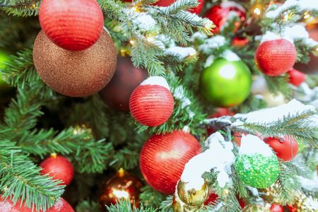 Toys and decorations on the Christmas tree. New Year holiday.の写真素材