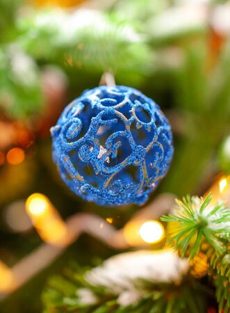 Toys and decorations on the Christmas tree. New Year holiday.の写真素材