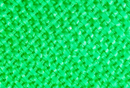 Green fabric material as an abstract background. Macroの写真素材