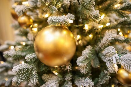 Toys and decorations on the Christmas tree. New Year holiday.の写真素材