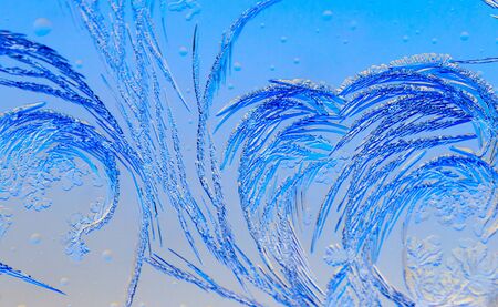 Natural pattern on glass at dawn of the sun. Abstract background