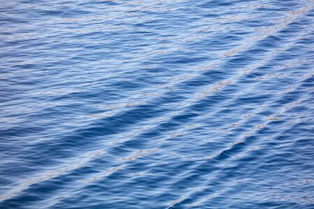 Blue expanse of water at sea as abstract background.