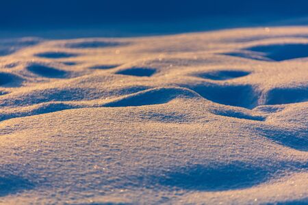 Snow at dawn in winter as a background.の写真素材