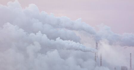 Smoke from the factory at dawn.の写真素材