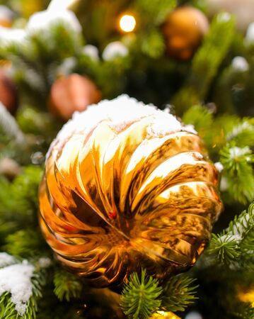 Toys and decorations on the Christmas tree. New Year holiday.の写真素材