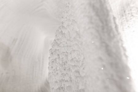 White walls of ice and snow in a cave.の写真素材