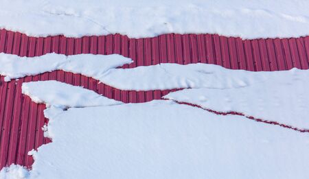 House with snow on the roof in winter.の写真素材