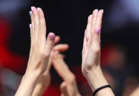 Hands clap at a rock concert.の写真素材