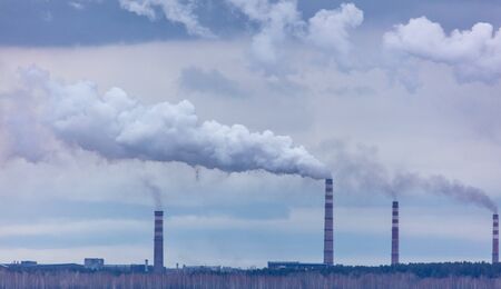 Smoke from the chimneys at the factory.