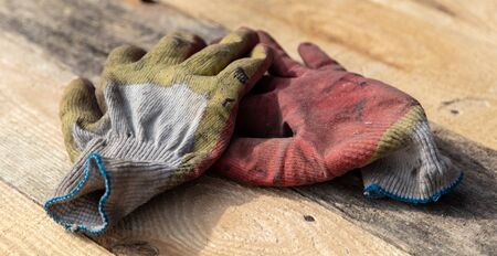 Worker's gloves at a construction site.の写真素材