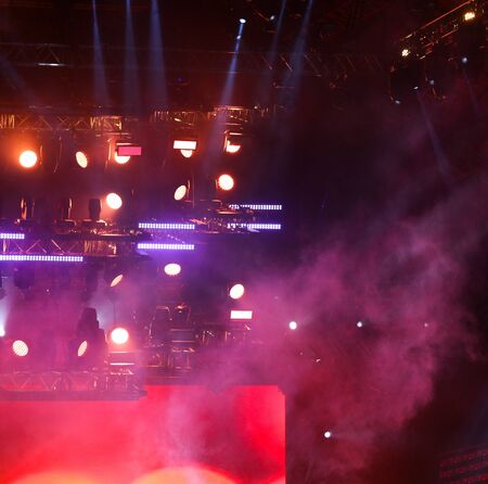 Red light on a rock concert stage as background.